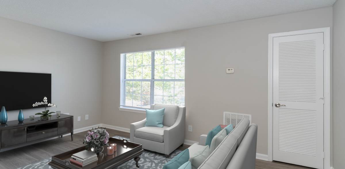 A resident relaxes on her sofa at Arbor Grove, Stafford, Virginia