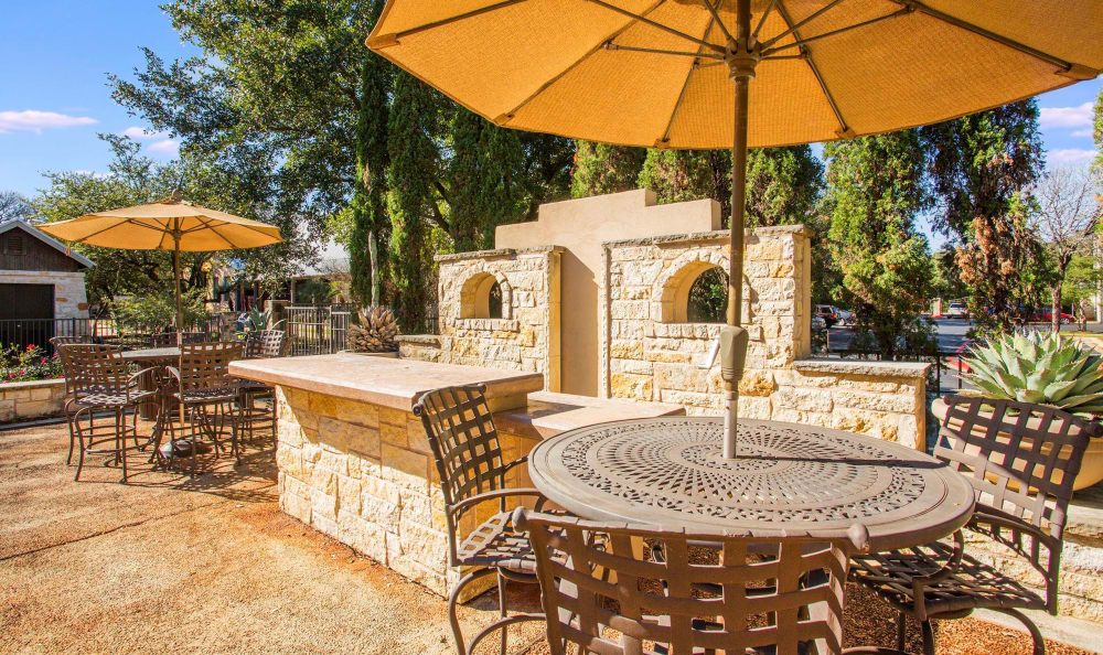 Shaded seating in an outdoor common area at Riata Austin in Austin, Texas