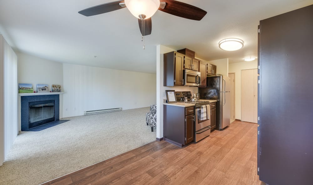 kitchen, living room with fireplace and dining room view