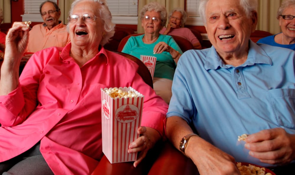 Residents enjoying popcorn and a movie at Valley Terrace in White River Junction, Vermont