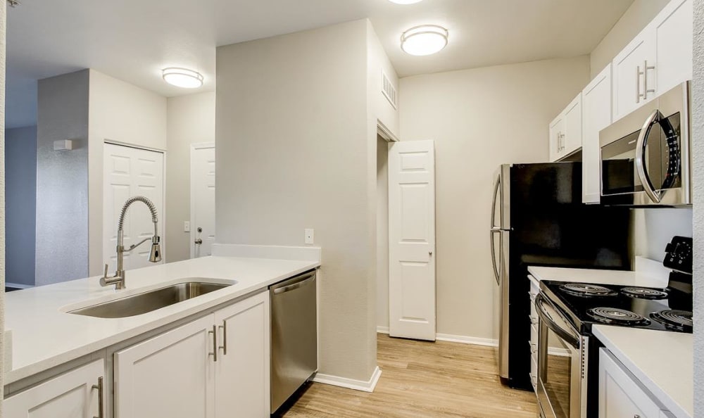 kitchen with modern appliances at The Highlands at Spectrum in Gilbert, AZ