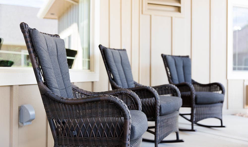 Wicker chairs sitting on the deck at Greenfield Estates in Akron, Ohio