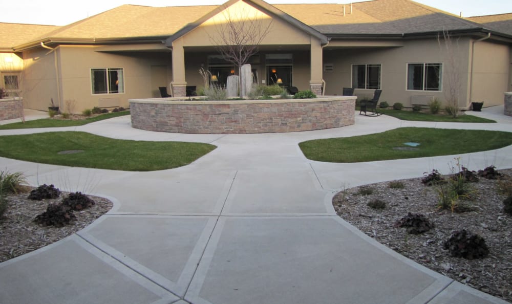 Courtyard with paved walking paths at Edgemont Place in Blaine, Minnesota