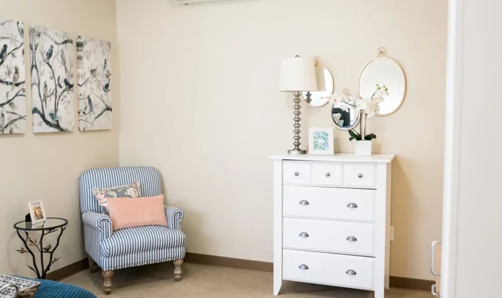 Bedroom chair and dresser at Pinnacle Place Memory Care in Little Rock, Arkansas