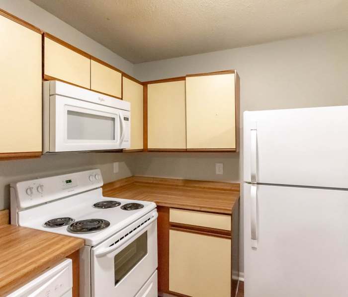 Kitchen with white color appliance at District on Wayne in Muncie, Indiana
