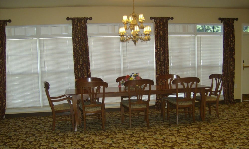 A large table in the community room at Atlantic at Twin Hickory in Glen Allen, Virginia