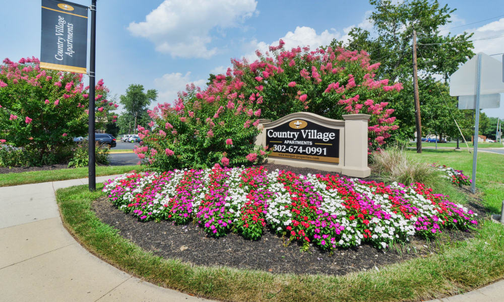 Exterior sign at Country Village Apartment Homes in Dover, Delaware.