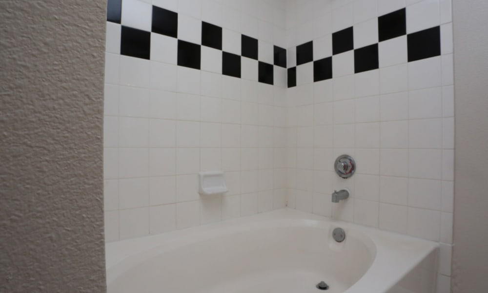 Cornerstone Ranch Apartments offers a bathroom with tub in Katy, Texas