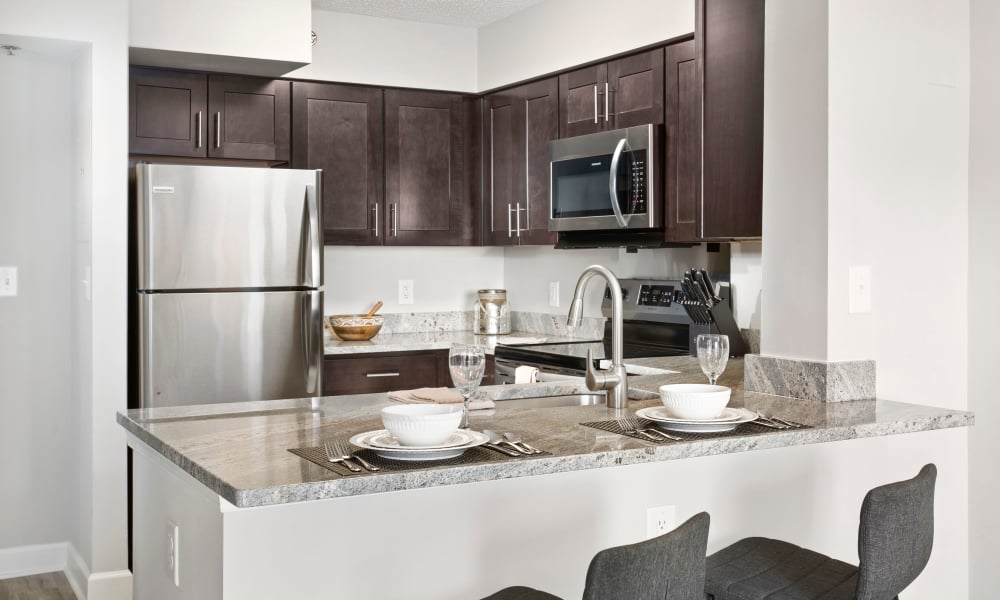 A model kitchen with stainless steel features at Alexander House in Silver Spring, Maryland