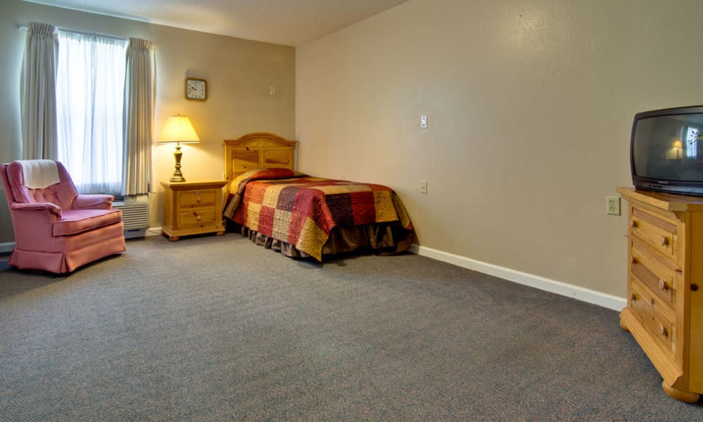 Large bedroom for assisted living residents at Henley Place in Neosho, Missouri