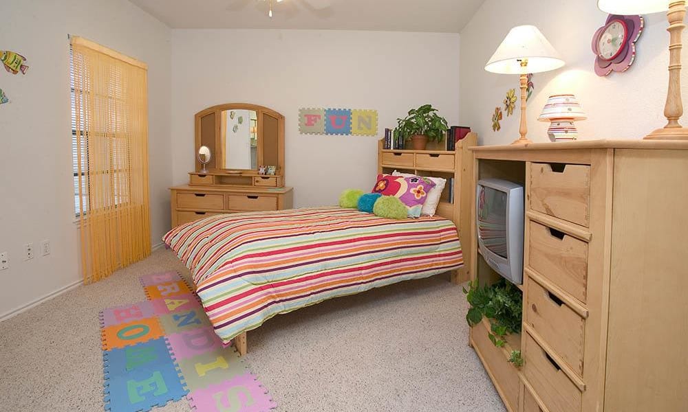 An apartment bedroom at Arbors of Pleasant Valley in Little Rock, Arkansas