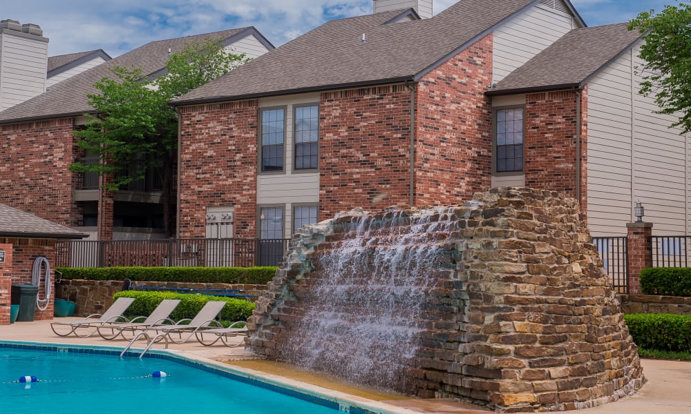 A waterfall by the pool at The Warrington Apartments in Oklahoma City, OK
