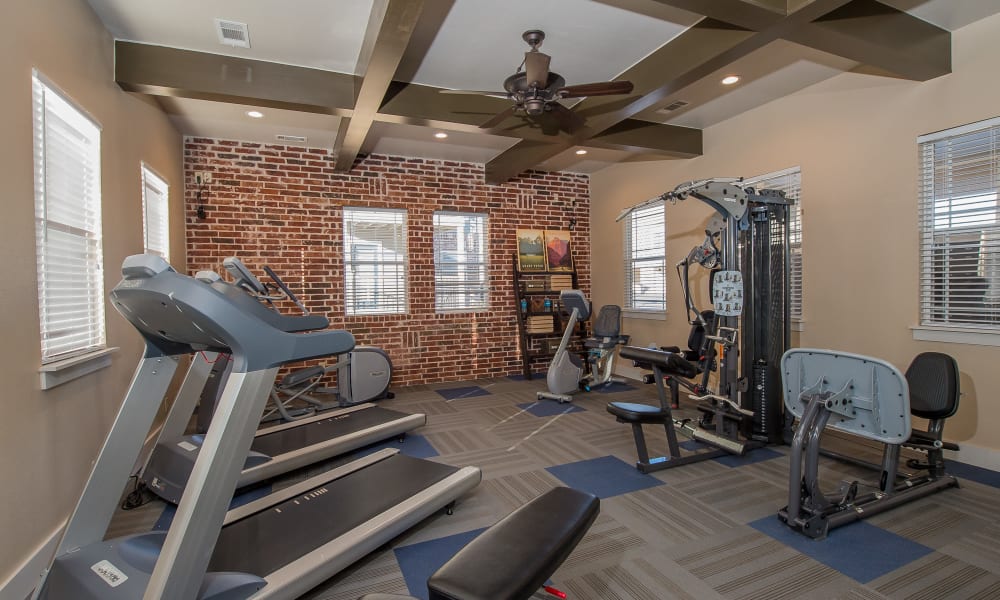 Well equipped fitness center at Cottages at Tallgrass Point Apartments in Owasso, Oklahoma
