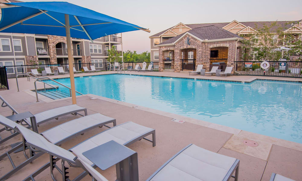 Large sparkling swimming pool at Cottages at Tallgrass Point Apartments in Owasso, Oklahoma