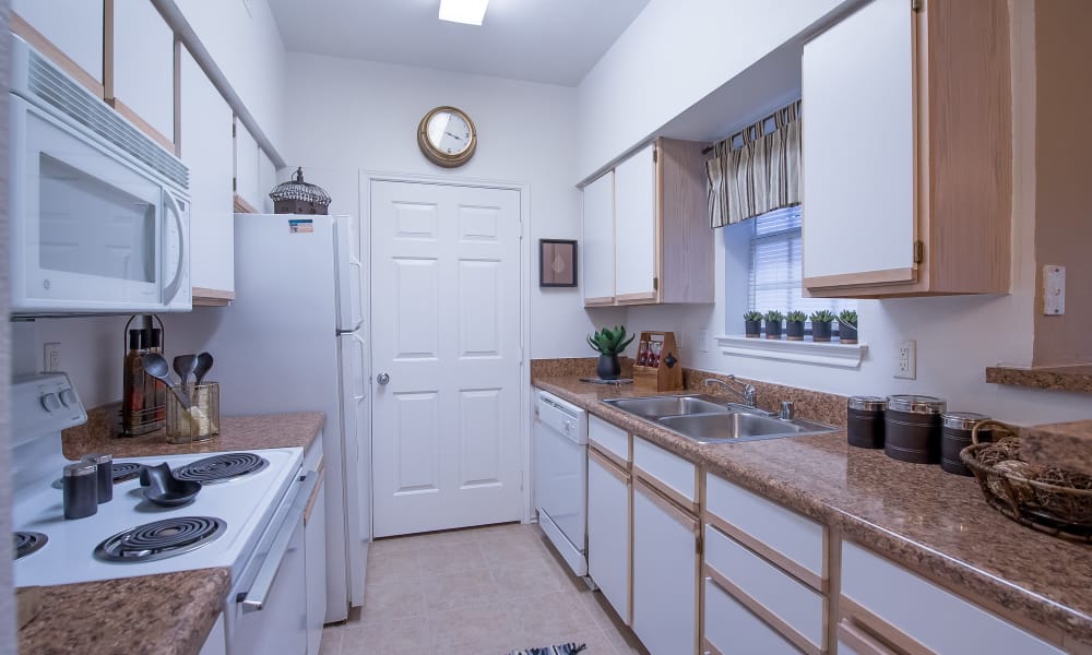 An apartment kitchen at Arbors of Pleasant Valley in Little Rock, Arkansas
