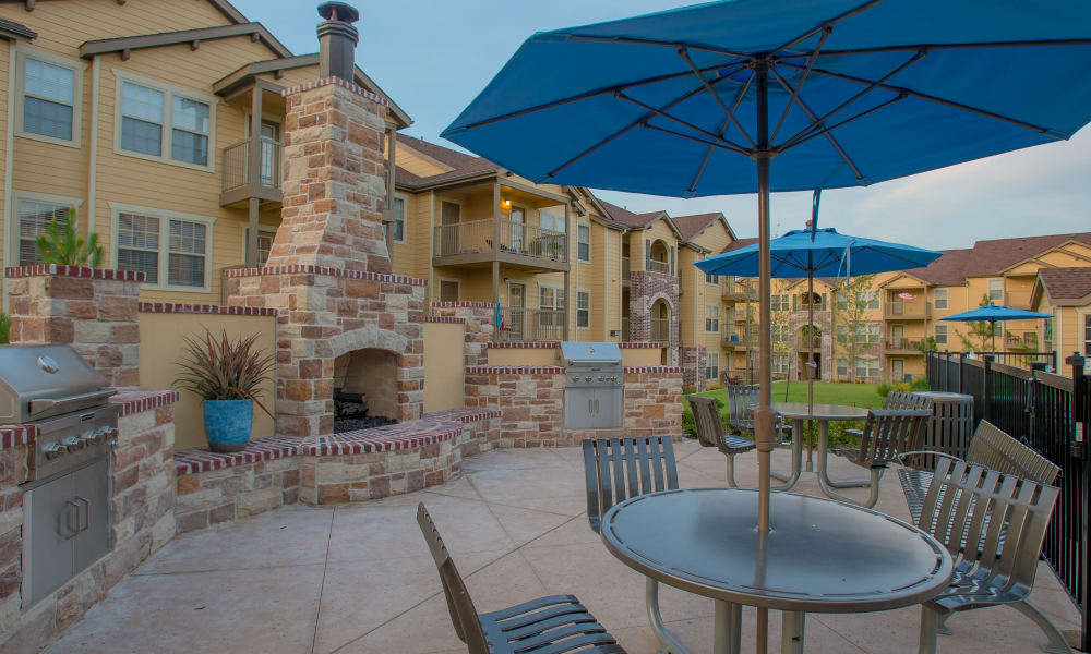 A patio area with fireplace at Cascata Apartments in Tulsa, Oklahoma