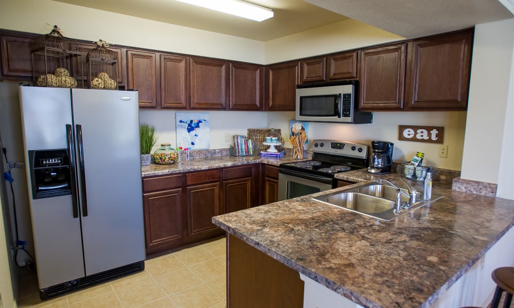 An apartment kitchen at Tuscany Hills in Tulsa, Oklahoma