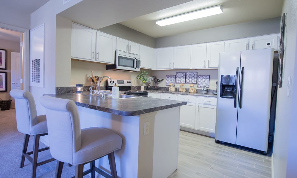Spacious kitchen with stainless steel appliances at Mission Point Apartments in Moore, Oklahoma
