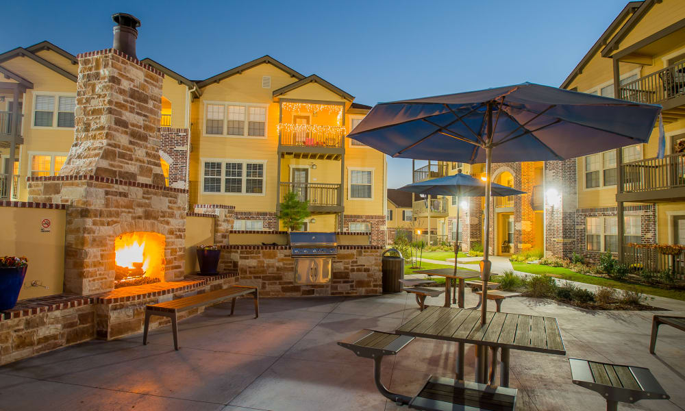 Outdoor patio with fireside seating at Mission Point Apartments in Moore, Oklahoma