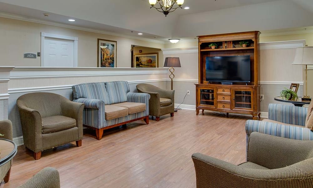 Entertainment room with comfortable seating at Parkwood Meadows Senior Living in Sainte Genevieve, Missouri