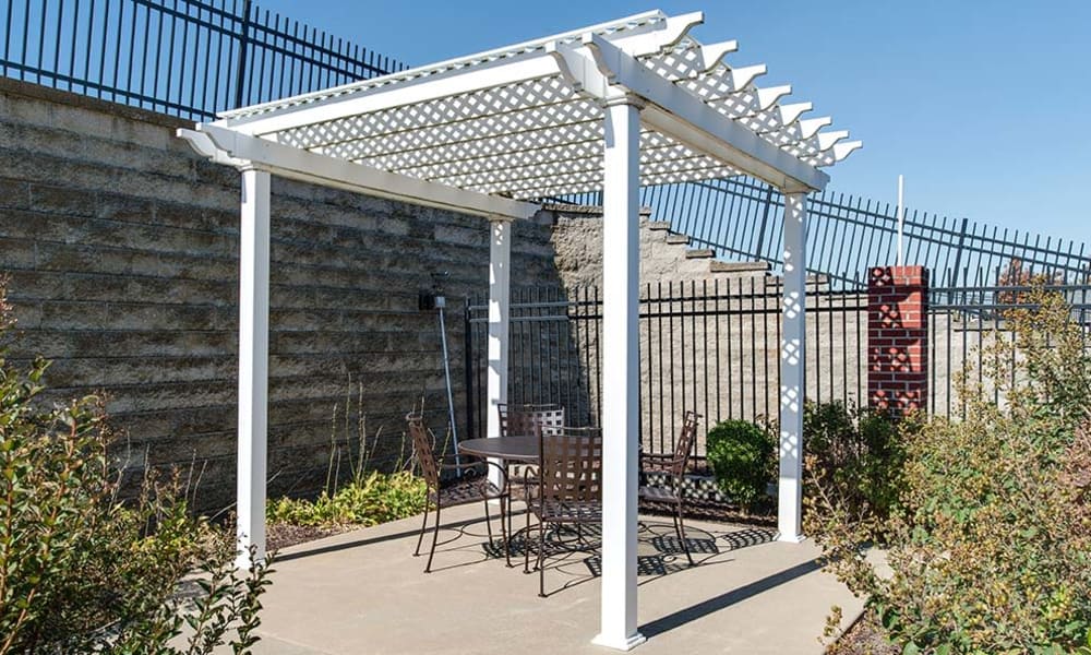 Concrete patio with a garden at Parkwood Meadows Senior Living in Sainte Genevieve, Missouri