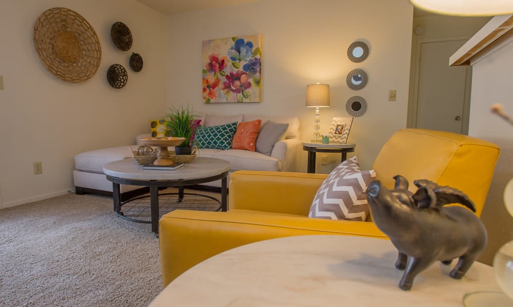 An apartment living room with furniture at Cimarron Trails Apartments in Norman, OK