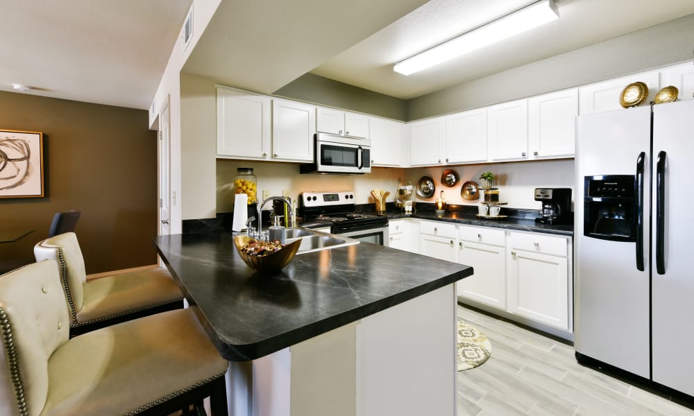 Kitchen with ample counter space at Cottages at Abbey Glen Apartments in Lubbock, Texas