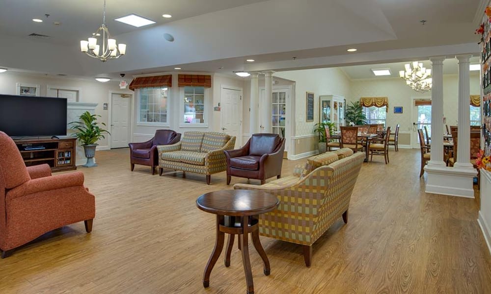 Entertainment room with comfortable seating at Chestnut Glen Senior Living in Saint Peters, Missouri