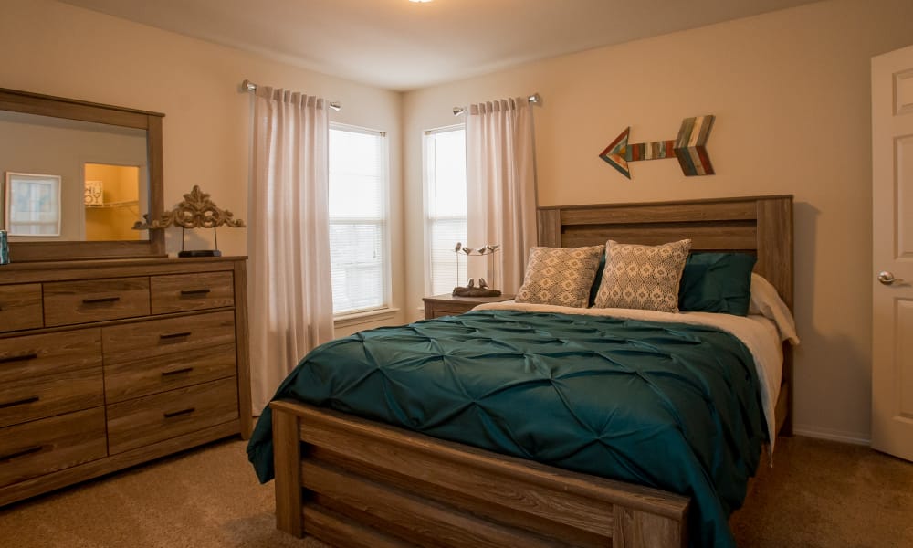 Large bedroom with a window at Villas of Waterford Apartments in Wichita, Kansas