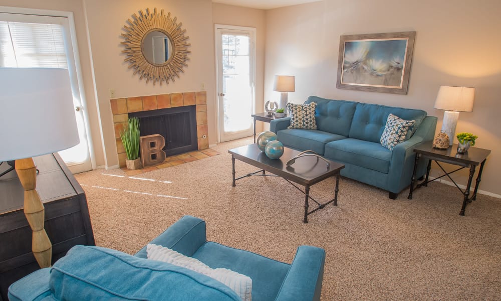 A lounge area with large couches at Barcelona Apartments in Tulsa, OK