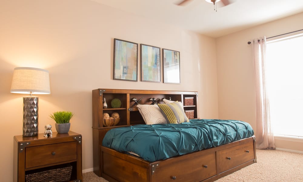 An apartment bedroom at Barcelona Apartments in Tulsa, OK