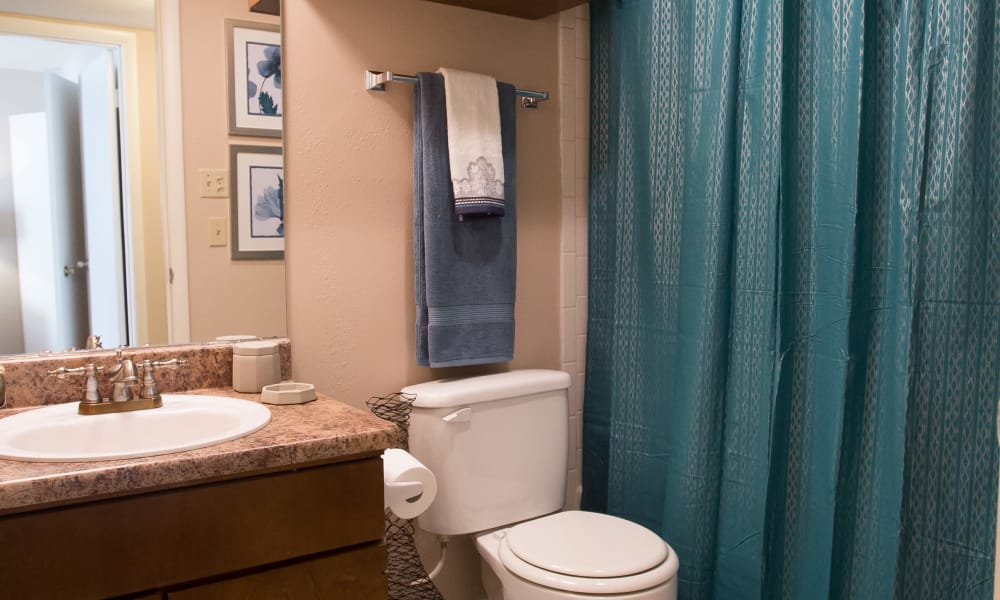 An apartment bathroom at Barcelona Apartments in Tulsa, OK