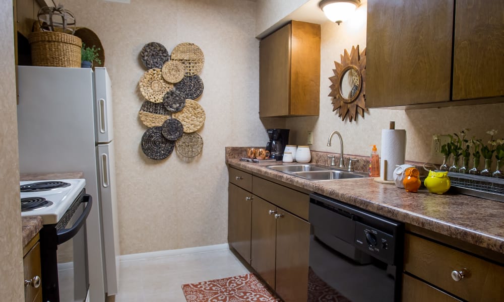 An apartment kitchen at Barcelona Apartments in Tulsa, OK