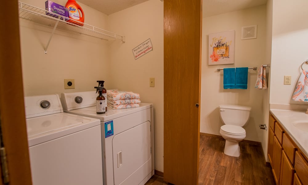 Bathroom with washer and dryer at Huntington Park Apartments in Wichita, Kansas