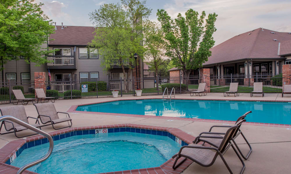 Hot tub and swimming pool at Huntington Park Apartments in Wichita, Kansas