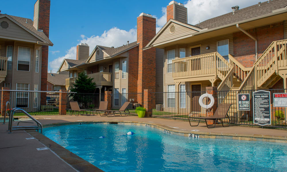 A large community pool at Persimmon Square Apartments in Oklahoma City, OK