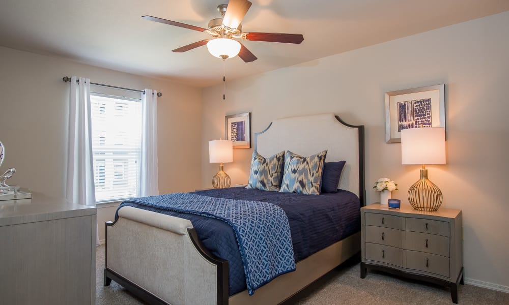 Bedroom with a ceiling fan at Scissortail Crossing Apartments in Broken Arrow, Oklahoma