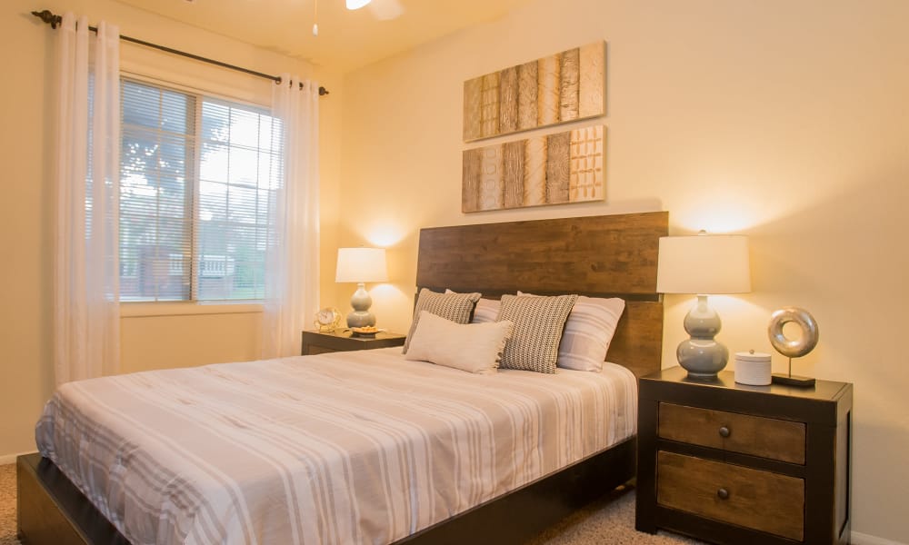 An apartment bedroom at The Courtyards in Tulsa, OK