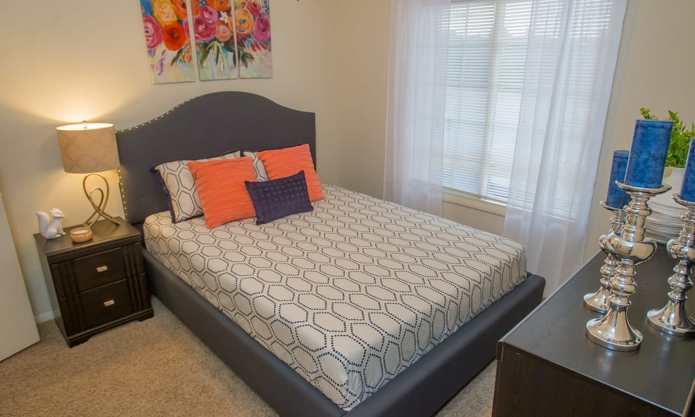 An apartment bedroom at The Courtyards in Tulsa, OK