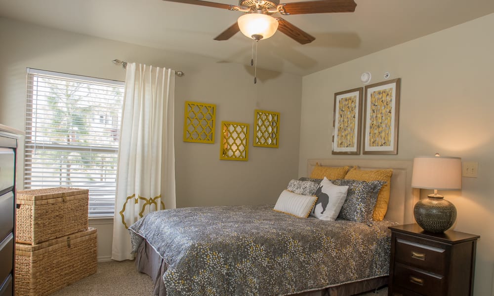 Cozy bedroom with a ceiling fan at The Reserve at Elm in Jenks, Oklahoma