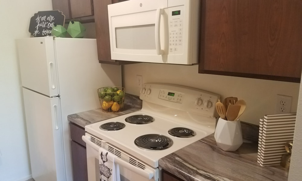 An apartment kitchen at The Chimneys Apartments in El Paso, Texas