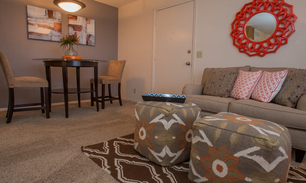 An apartment living room and dining room at Tammaron Village Apartments in Oklahoma City, OK