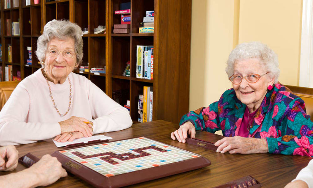 Residents playing scrabble at Traditions of Hershey in Palmyra, Pennsylvania