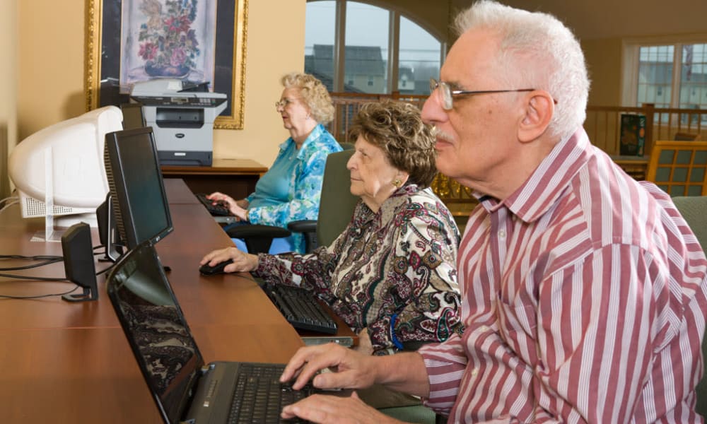 Resident using the computer lab at Traditions of Hershey in Palmyra, Pennsylvania