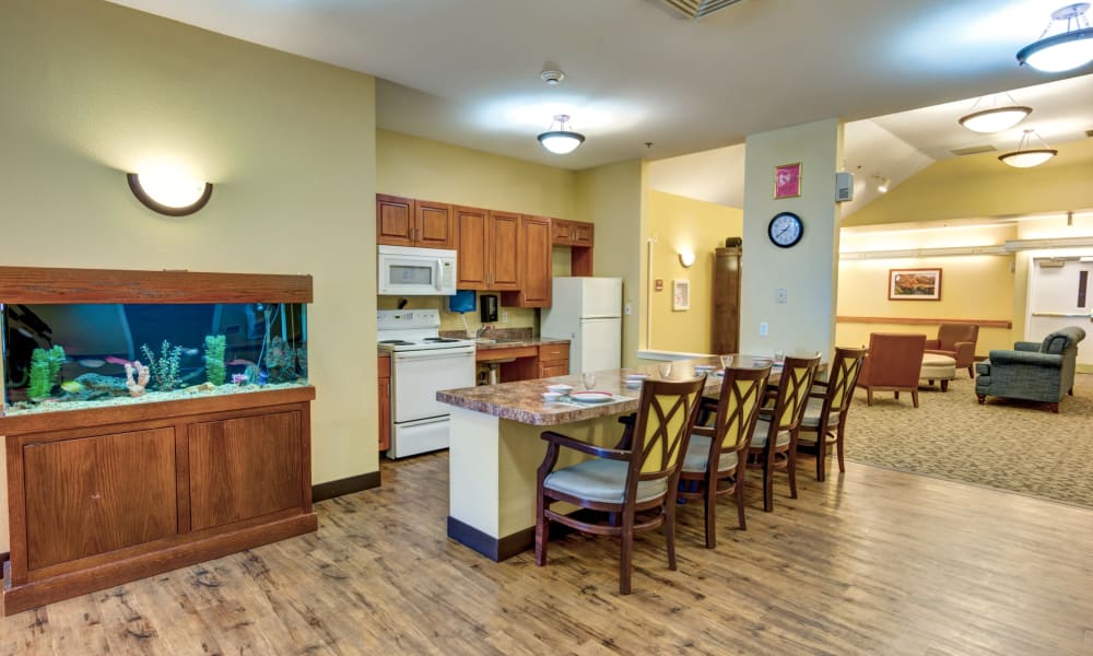 A fish tank next to the community kitchen at Rosewood Memory Care in Hillsboro, Oregon