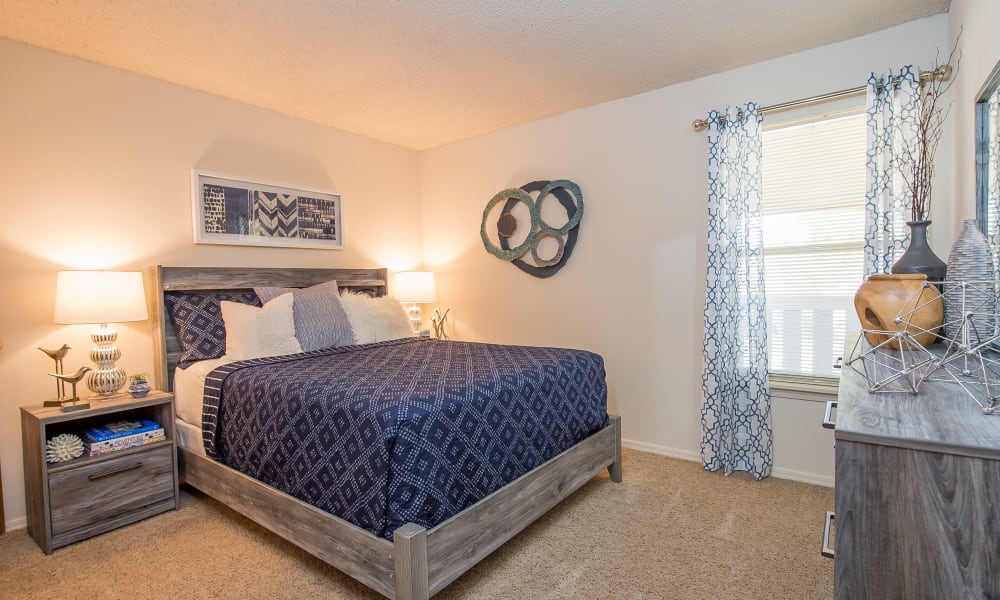 An apartment bedroom at Sunchase Ridgeland Apartments in Ridgeland, MS