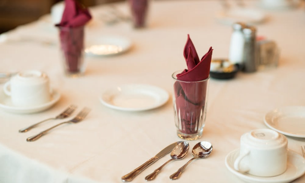 Dining room table set for a feast at Keystone Place at Legacy Ridge in Westminster, Colorado