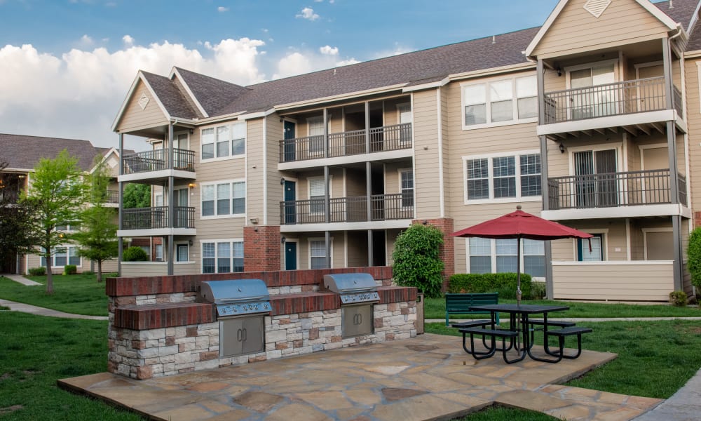 An outdoor patio area with grill at Winchester Apartments in Amarillo, Texas