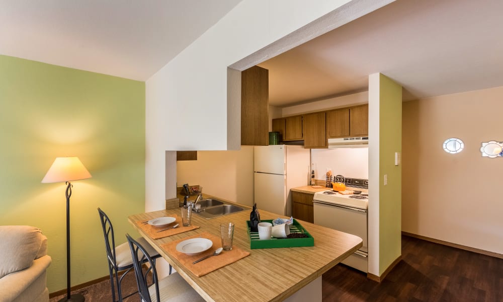Kitchen and bar at Kellogg Cove Apartments in Kentwood, Michigan