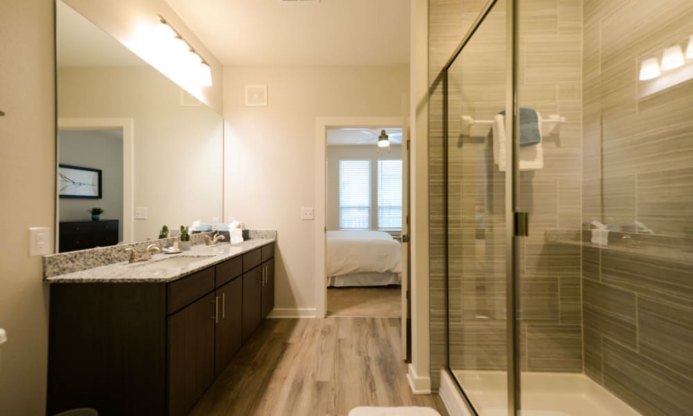 Bathroom with walk-in shower at Luxor Club in Jacksonville, Florida